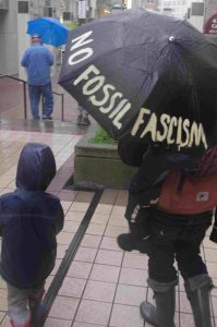 Umbrella shields against Fossil Fascism