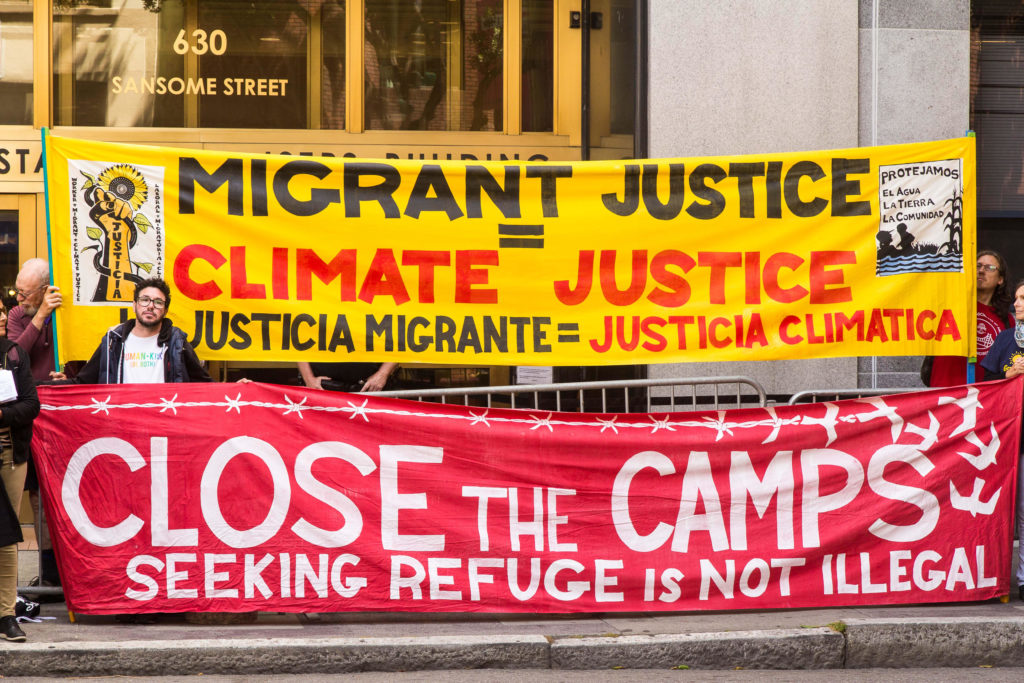 Migrant Justice Is Climate Justice - August 5, 2019 - Banners by David Solnit et al. - photo by Steve Nadel
