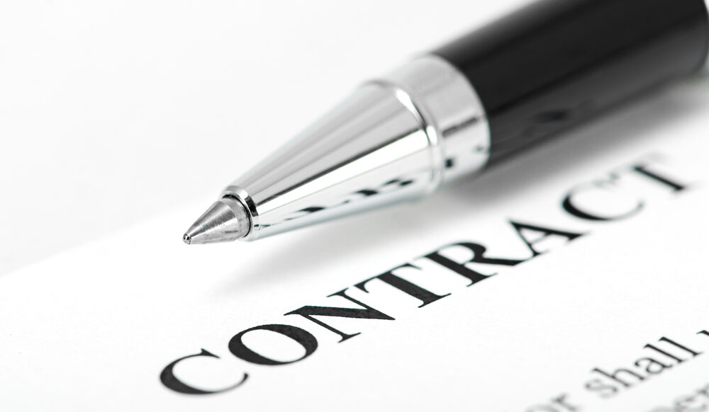 Contract Law image (ballpoint pen atop a portion of a contract), from Wikimedia Commons; public domain. https://commons.wikimedia.org/wiki/File:ContractLaw.jpg