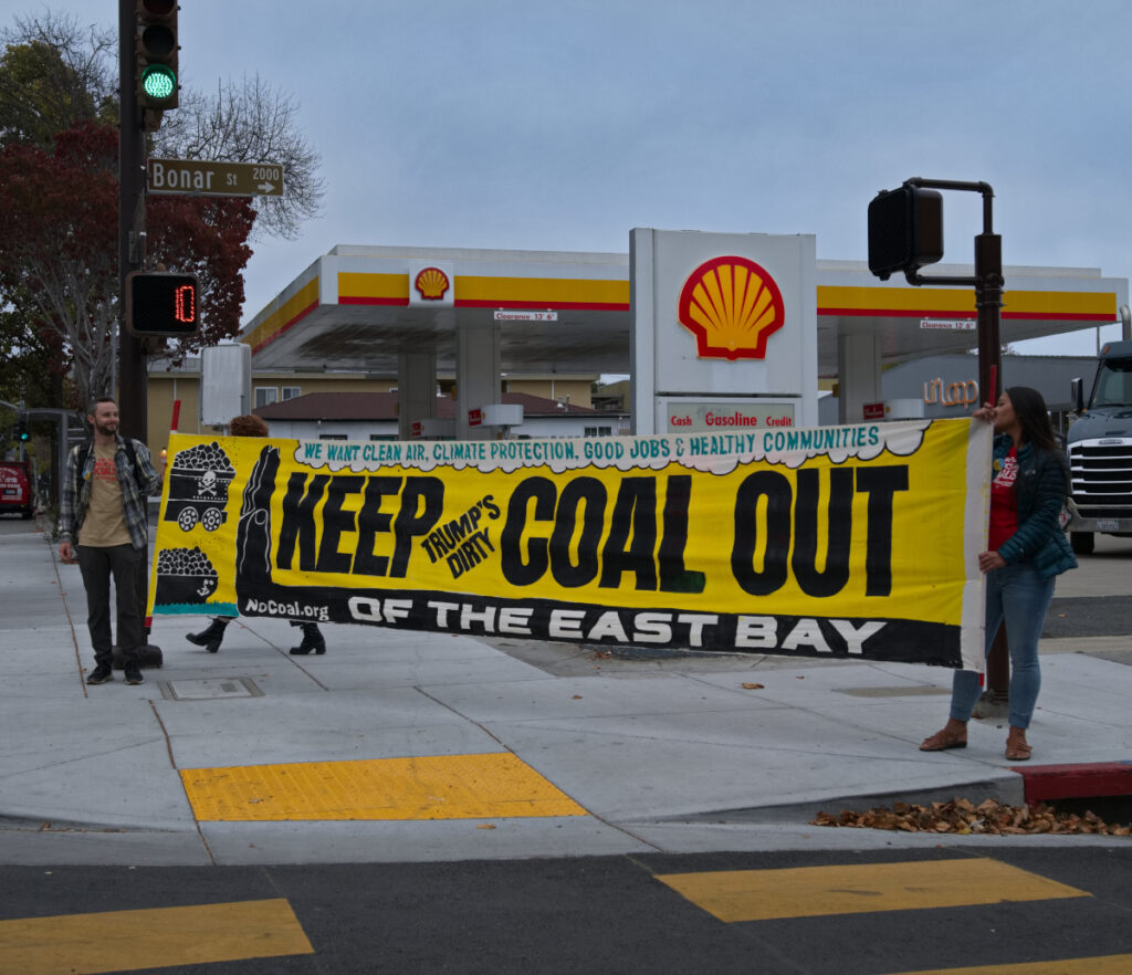 Banner at Berkeley Rally, 2026-09-15. Photo Credit Leon Kunstenaar.