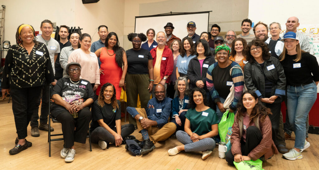 WOCAP Steering Committee members, community participants, and WOEIP staff at the WOCAP town hall in 2024.